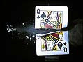 [
playing card cut with bullet]